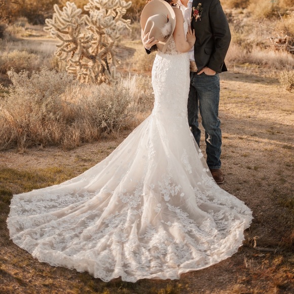 I’m selling my wedding dress! The dress is a size 6 and the color is Ivory white